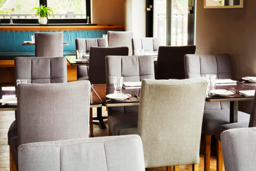 How to clean fabric upholstered chairs for a restaurant filled with chairs
