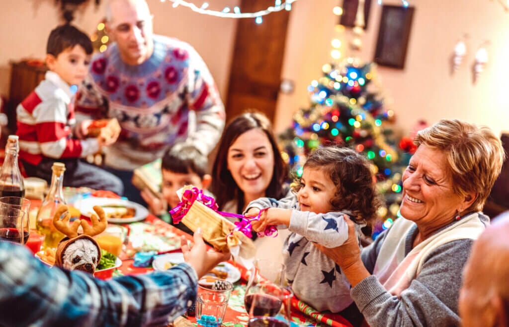 Big family celebrating christmas without fear of a post party cleaning service