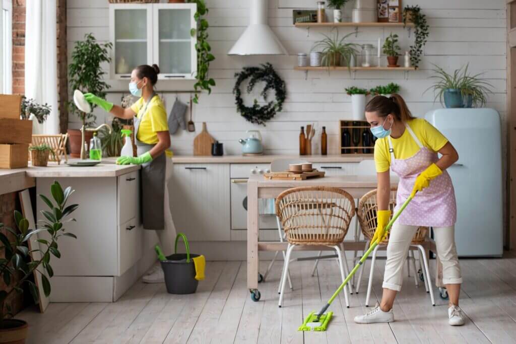 Cleaning service taking care of the client's kitchen.
