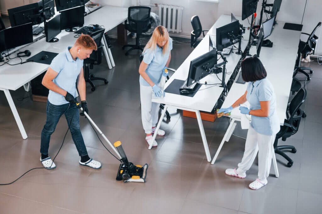Group of workers cleaning an office