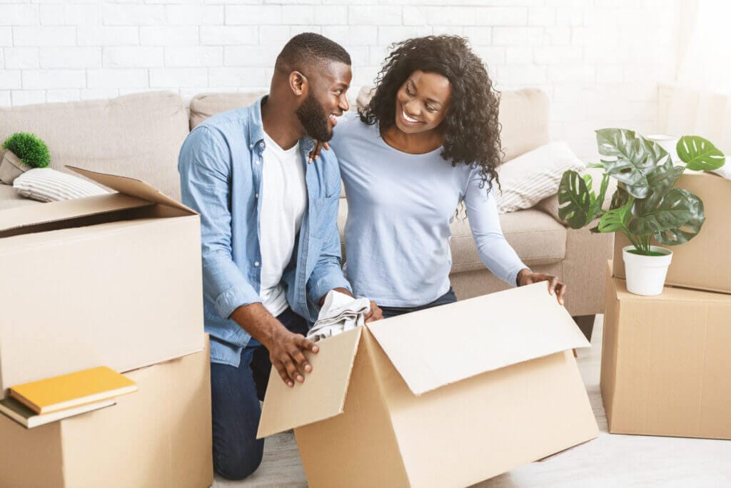 Excited couple getting ready for moving out