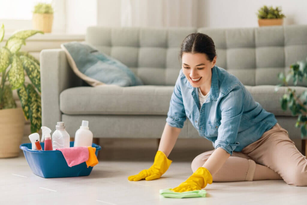 Woman deep cleaning her carpet